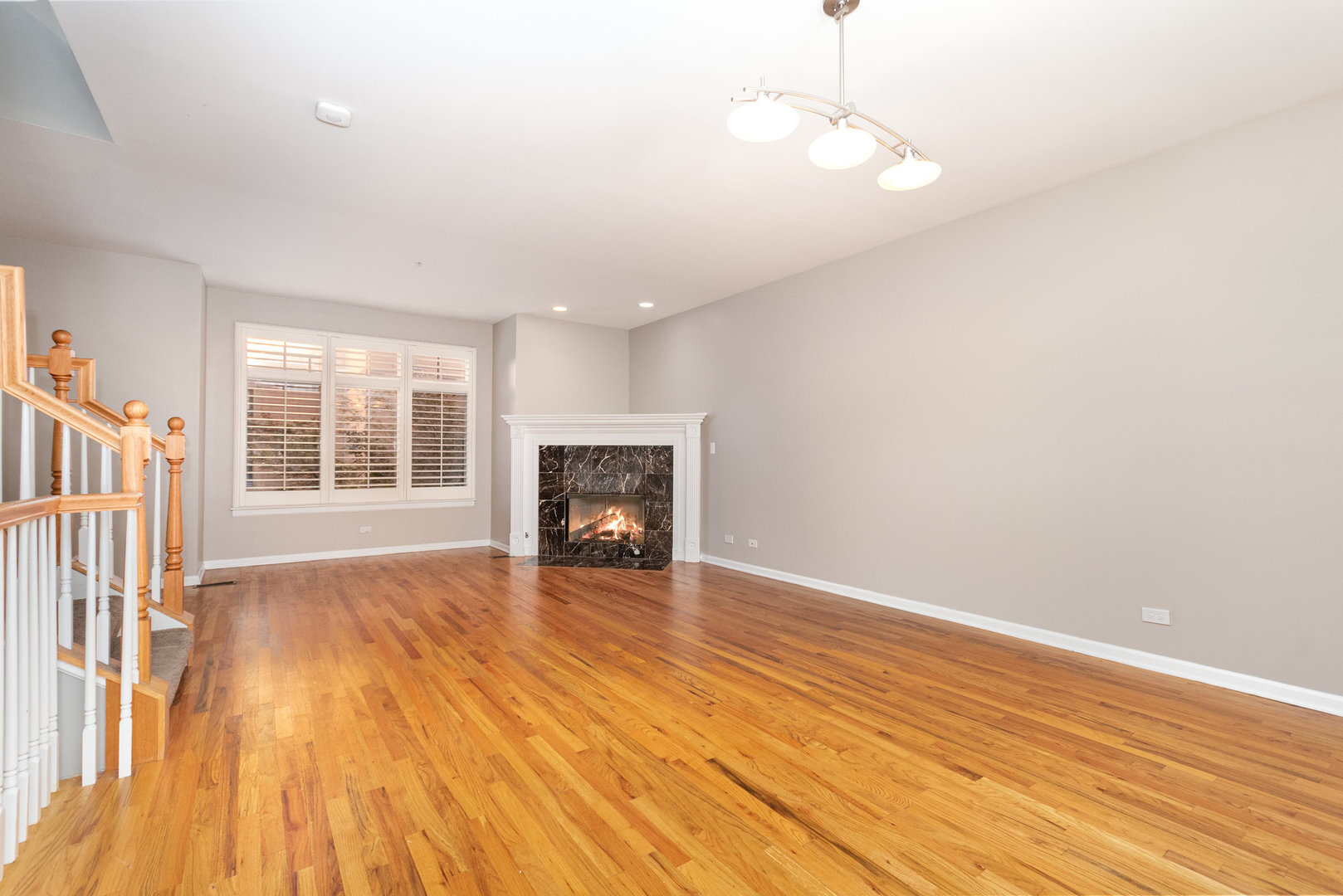1022 Alexander Lane Oak Park, IL 60302 - Photo 12 of 19 a view of an empty room with wooden floor and a window