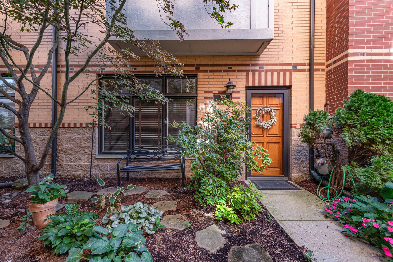 1022 Alexander Lane Oak Park, IL 60302 - Photo 2 of 19 a front view of a house with a garden