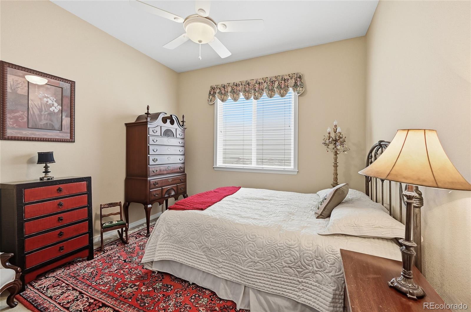 2626 Pemberly Avenue Highlands Ranch, CO 80126 - Photo 17 of 49 a bedroom with a bed and a window