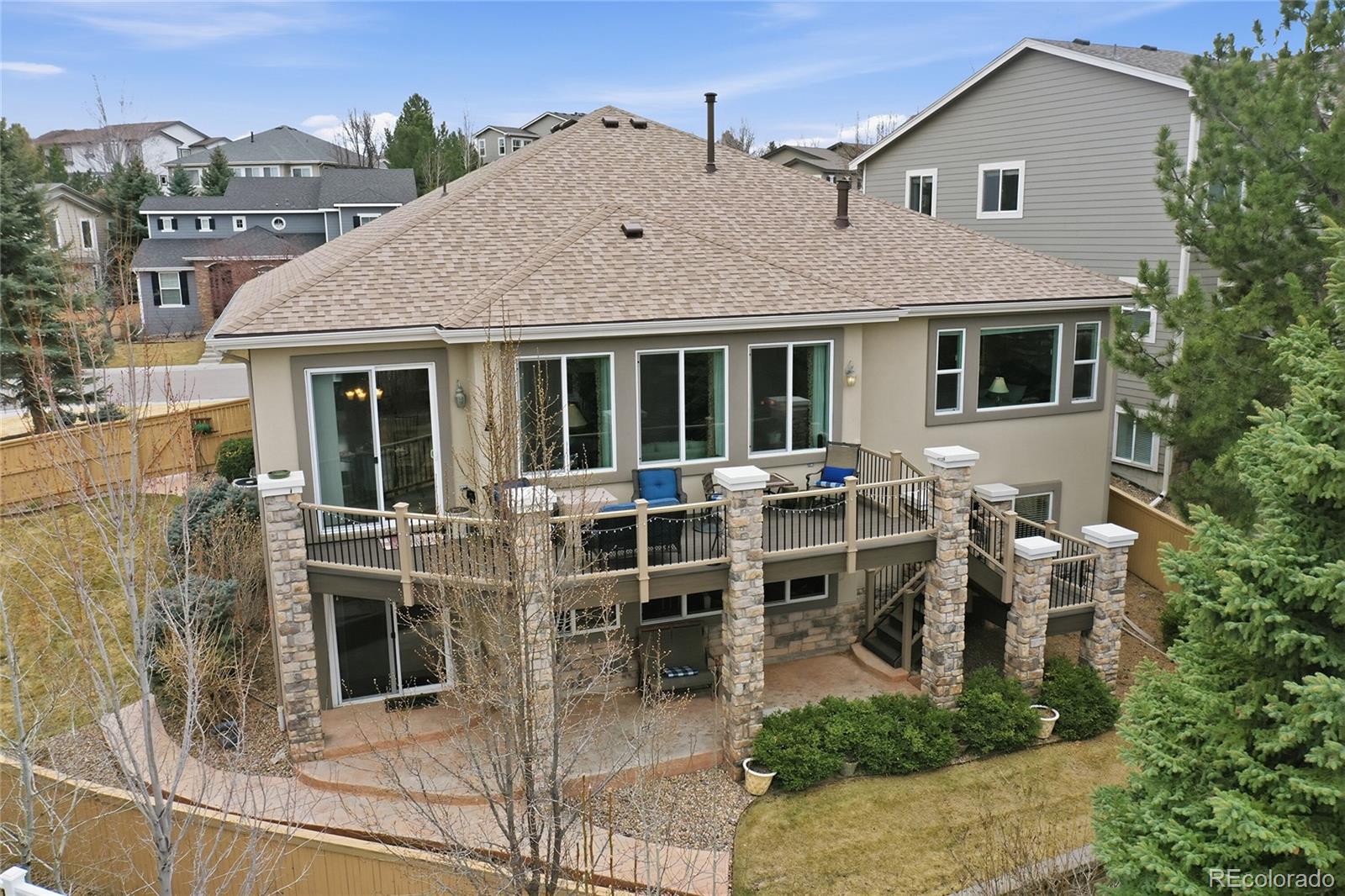 2626 Pemberly Avenue Highlands Ranch, CO 80126 - Photo 2 of 49 a view of a house with a porch and furniture