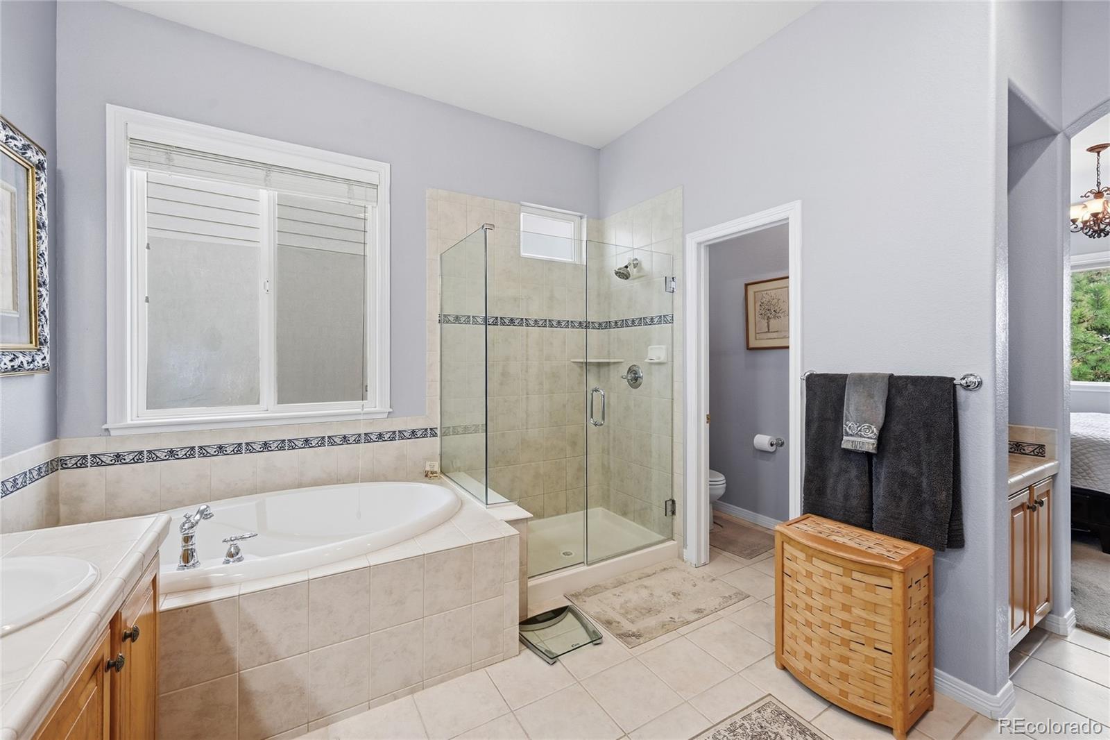 2626 Pemberly Avenue Highlands Ranch, CO 80126 - Photo 21 of 49 a bathroom with a bathtub and a shower