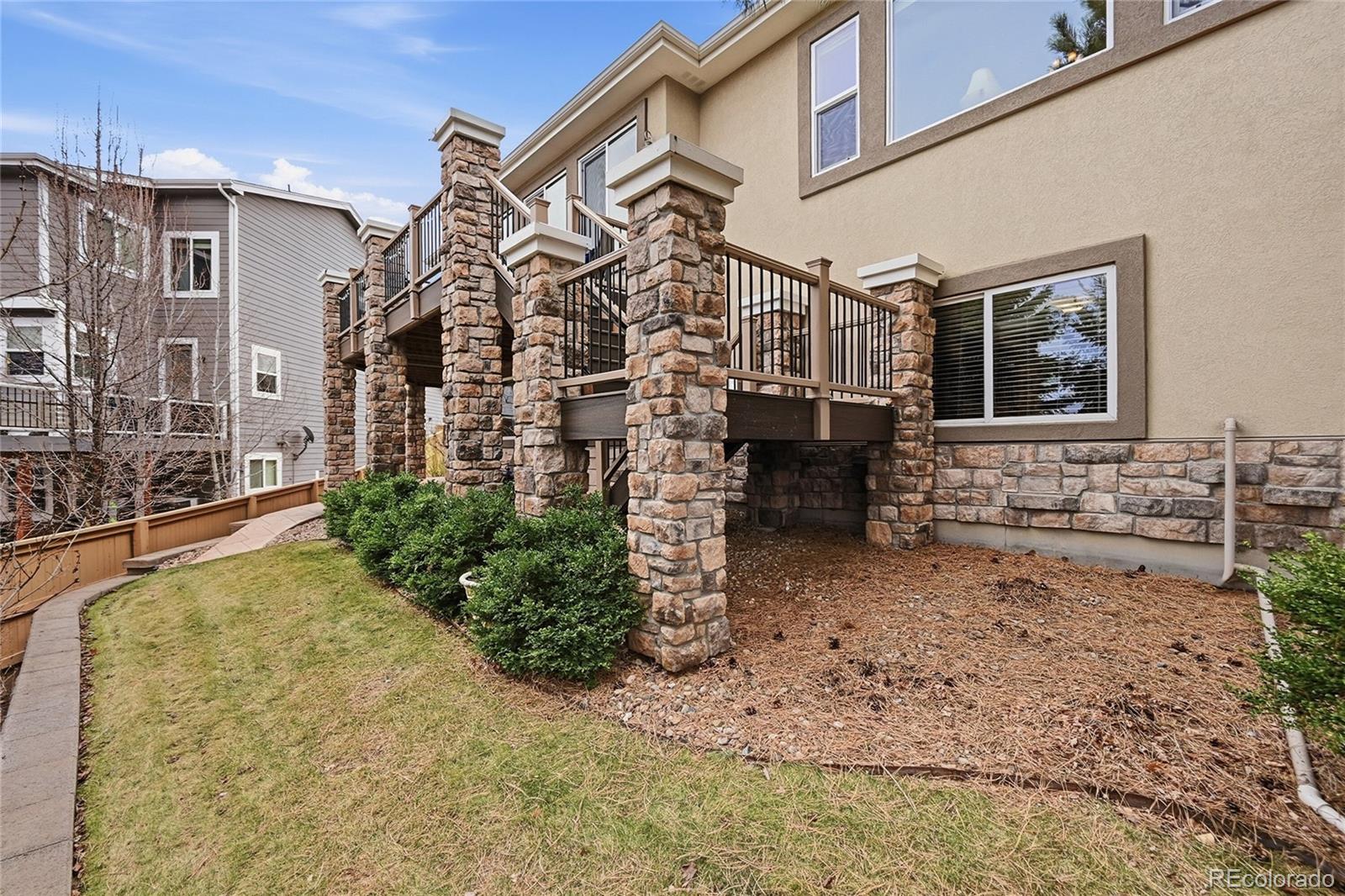 2626 Pemberly Avenue Highlands Ranch, CO 80126 - Photo 39 of 49 a view of a house with a yard