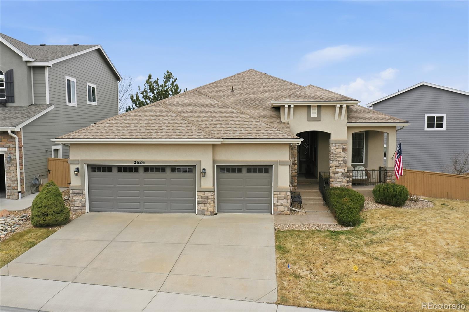 2626 Pemberly Avenue Highlands Ranch, CO 80126 - Photo 40 of 49 a front view of a house with patio