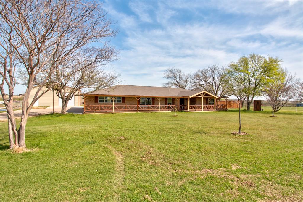 3884 Lois Road East Sanger, TX 76266 - Photo 5 of 40 a front view of a house with a yard