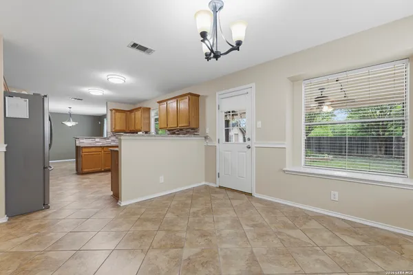 a view of a kitchen with furniture and windows