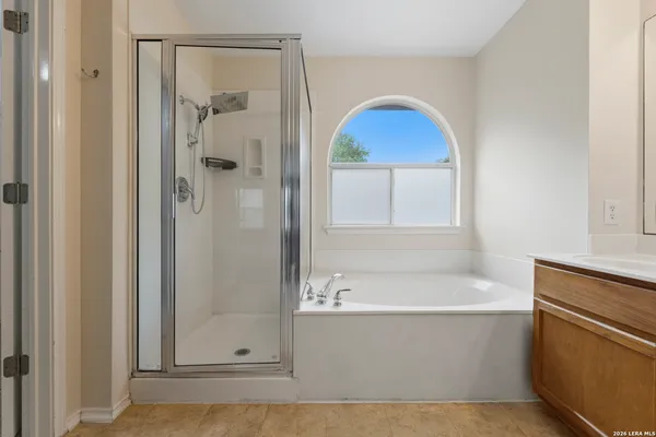 a bathroom with a bathtub and a shower