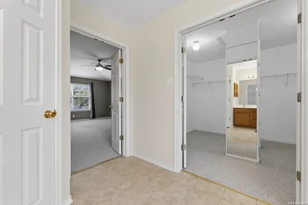 wooden floor and closet in a en suite bathroom