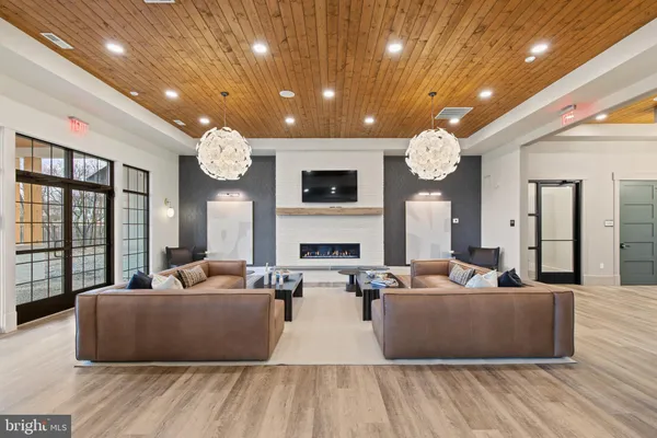 a living room with fireplace furniture and a flat screen tv