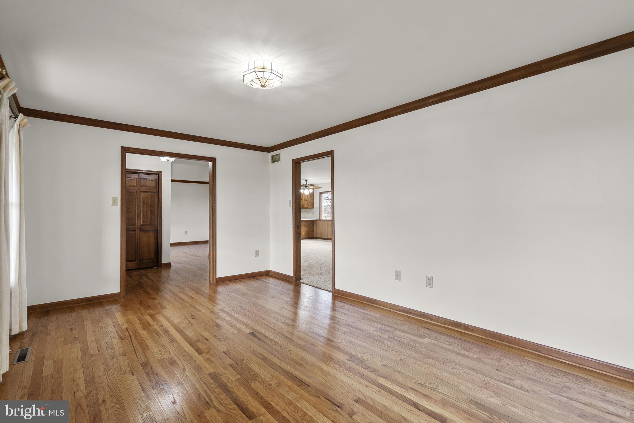 9224 Ball Road Ijamsville, MD 21754 - Photo 11 of 56 a view of an empty room with wooden floor and closet