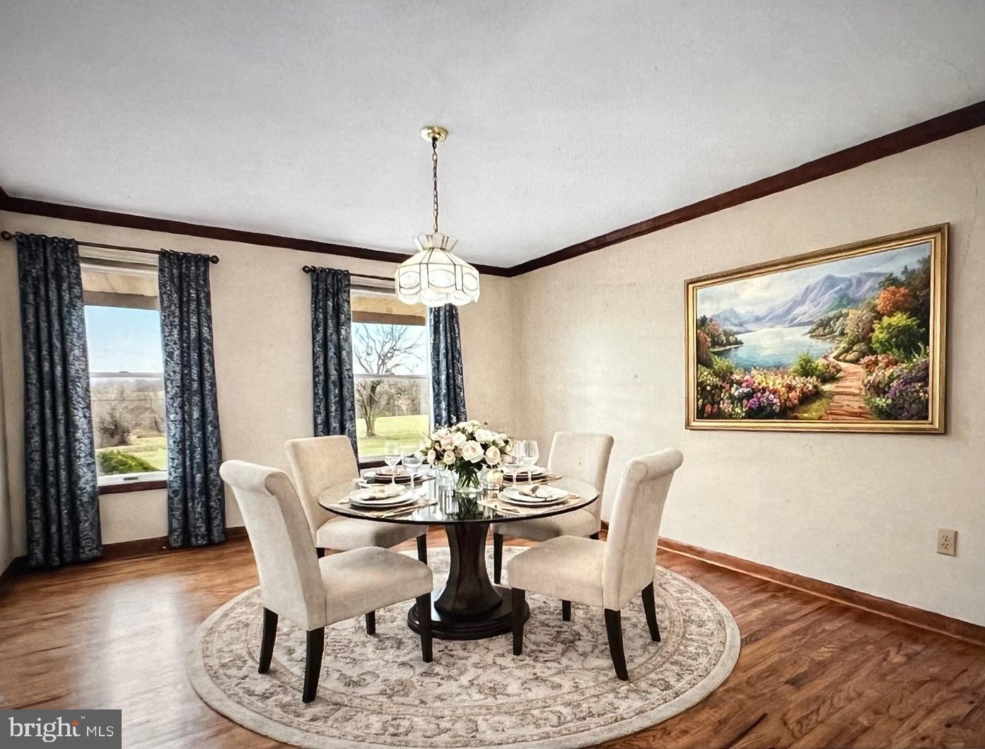 9224 Ball Road Ijamsville, MD 21754 - Photo 14 of 56 a dining room with furniture wooden floor and a chandelier