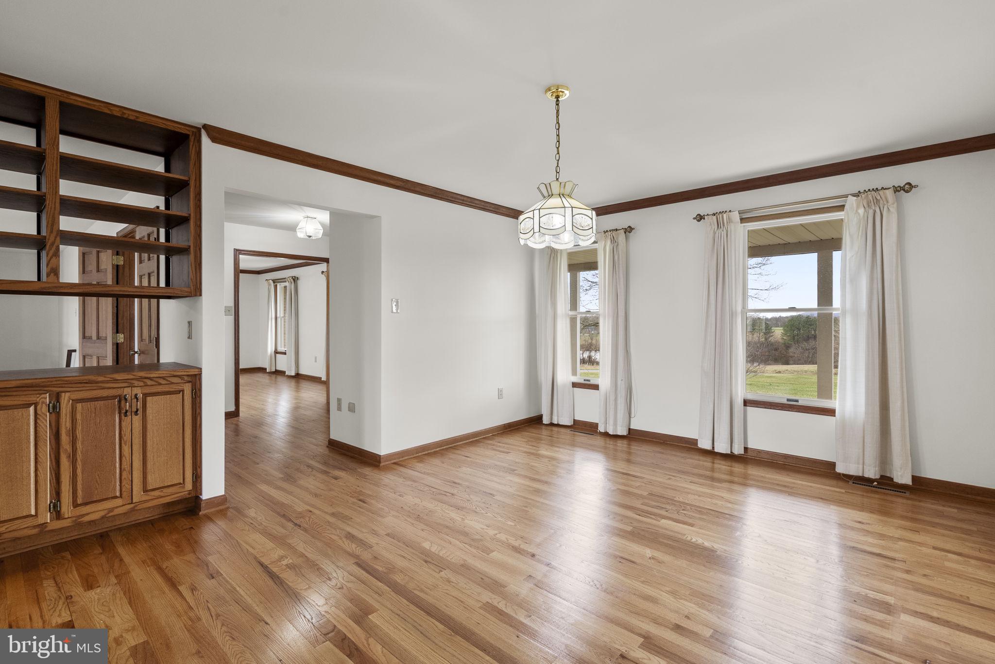 9224 Ball Road Ijamsville, MD 21754 - Photo 15 of 56 a view of an empty room with window and wooden floor