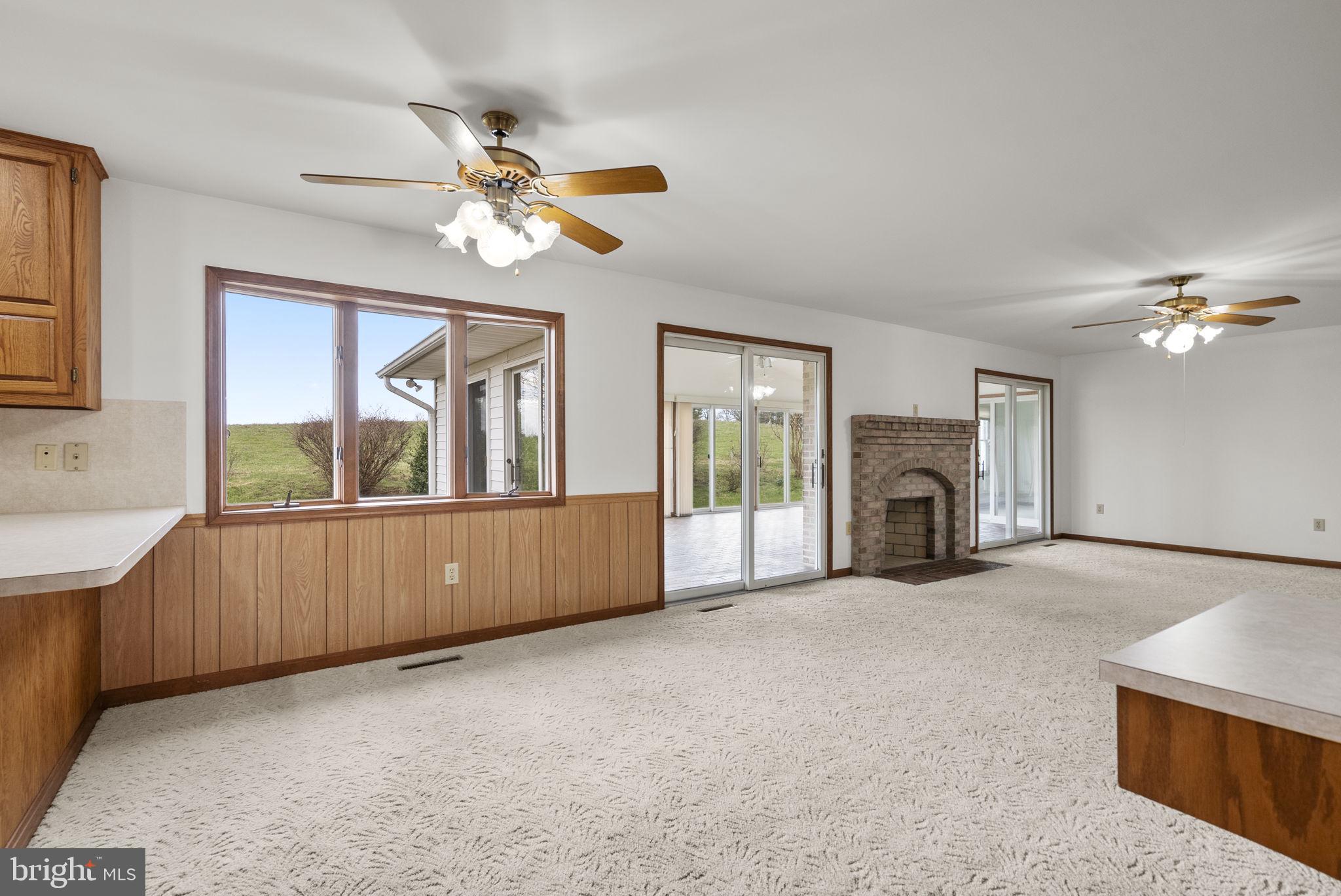 9224 Ball Road Ijamsville, MD 21754 - Photo 20 of 56 a living room with furniture and a fireplace