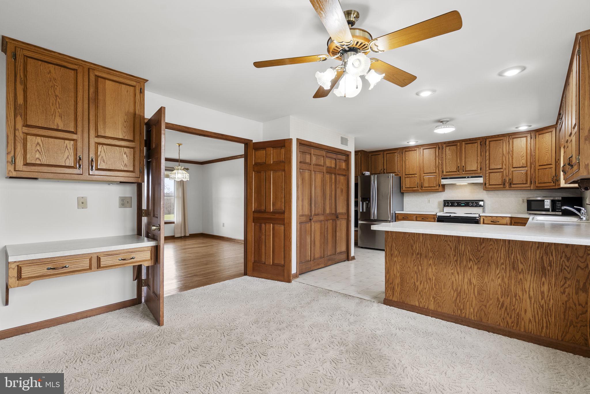 9224 Ball Road Ijamsville, MD 21754 - Photo 23 of 56 a view of kitchen with stainless steel appliances wooden floor and a refrigerator