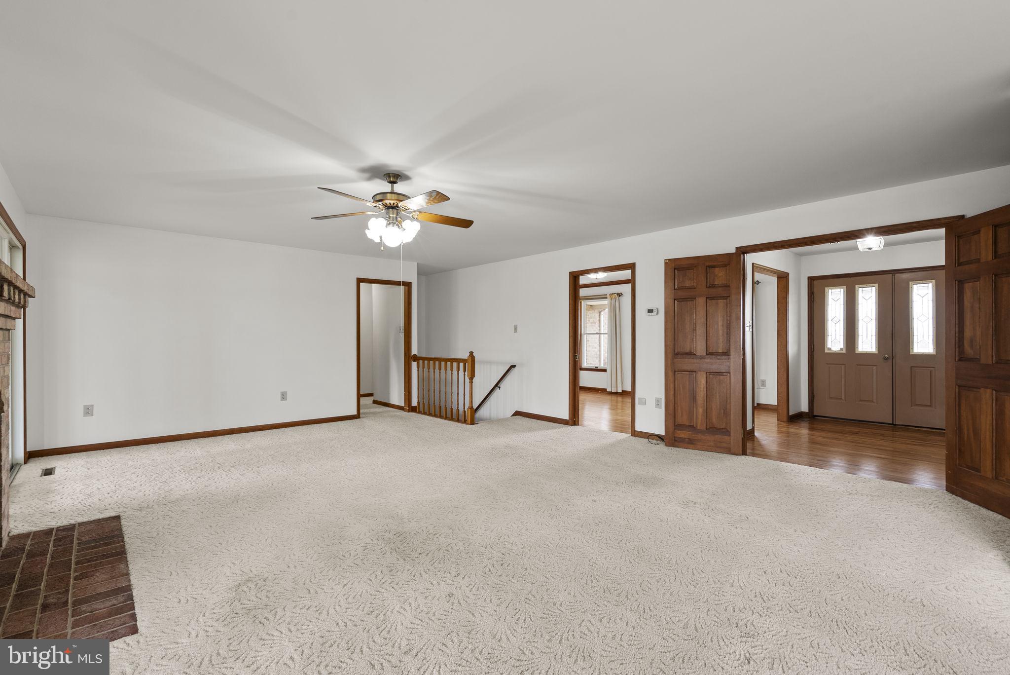 9224 Ball Road Ijamsville, MD 21754 - Photo 26 of 56 a view of a livingroom with a ceiling fan and window