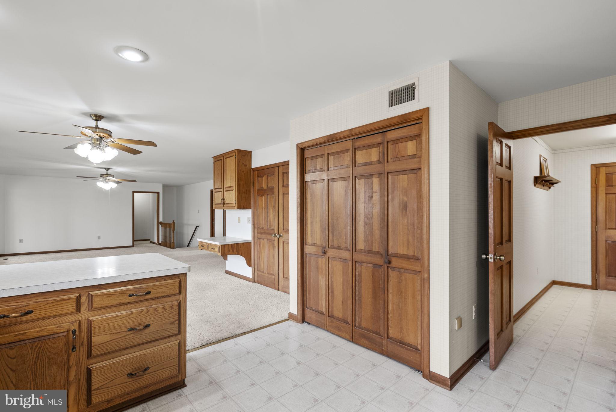 9224 Ball Road Ijamsville, MD 21754 - Photo 27 of 56 a view of kitchen with a refrigerator cabinets and a ceiling fan