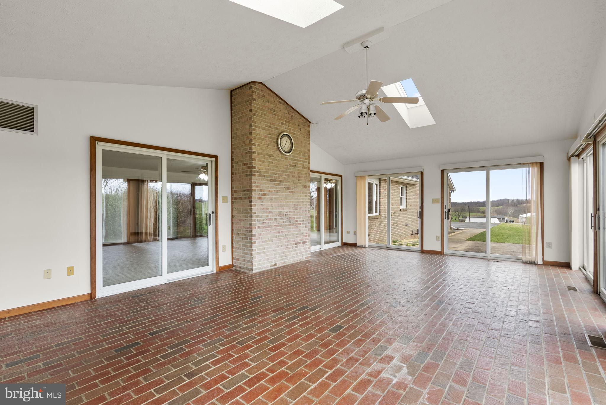 9224 Ball Road Ijamsville, MD 21754 - Photo 42 of 56 a view of an empty room with window and wooden floor