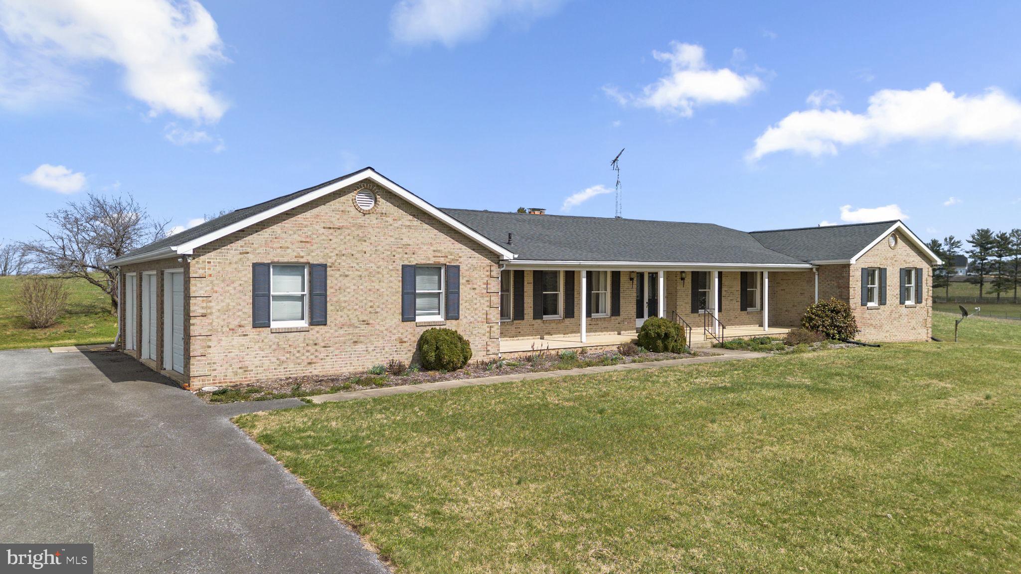 9224 Ball Road Ijamsville, MD 21754 - Photo 54 of 56 a front view of a house with a yard and porch