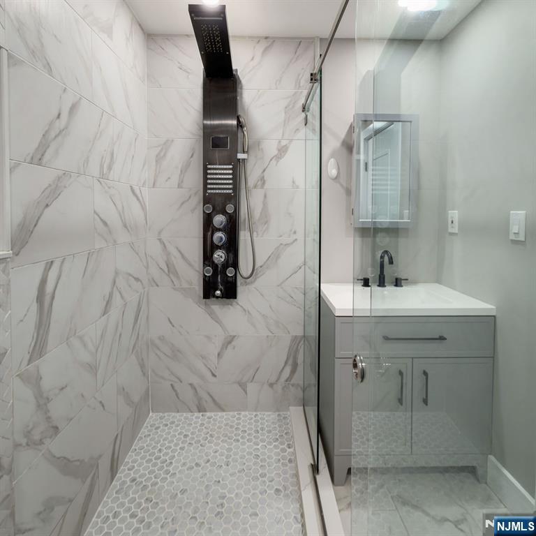 76 Mission Street Montclair, NJ 07042 - Photo 12 of 50 a bathroom with a sink and a mirror