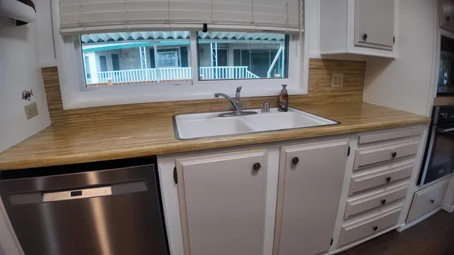 a kitchen with a sink and cabinets