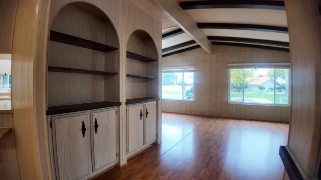 a view of an entryway with wooden floor