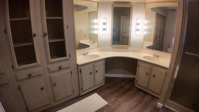 a bathroom with a sink and a mirror