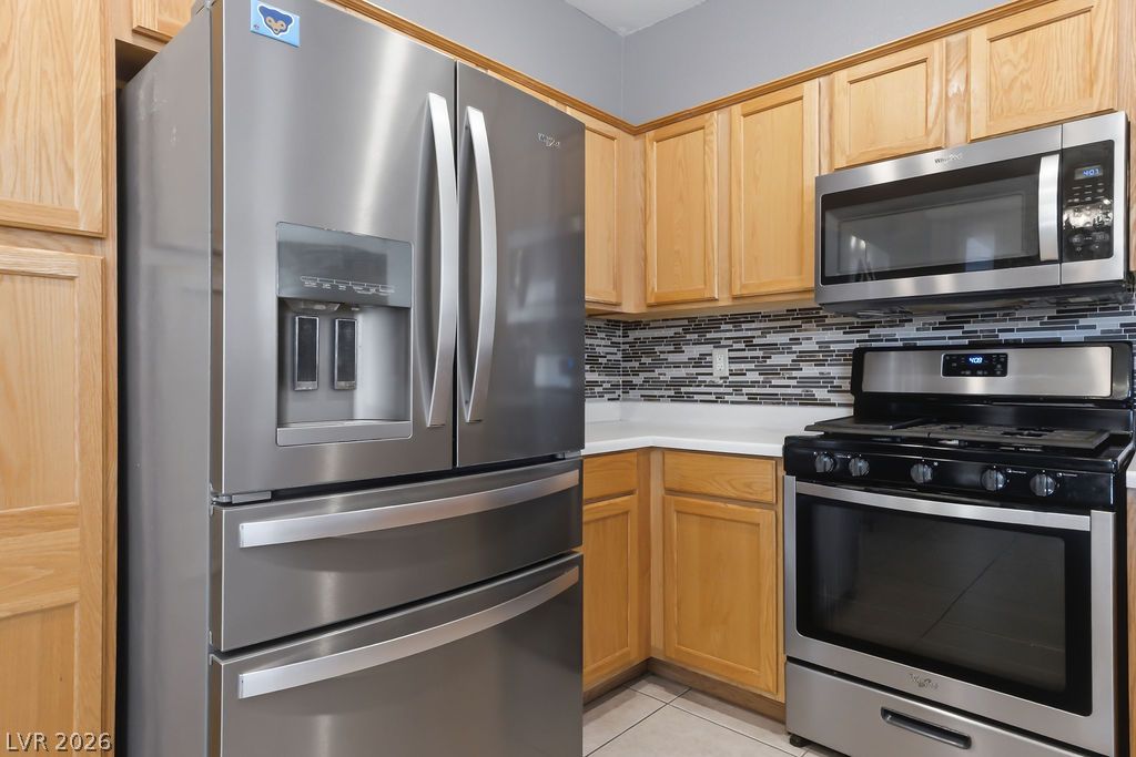 754 Solitude Point Avenue Henderson, NV 89012 - Photo 17 of 38 A well-equipped kitchen showcasing modern stainless steel appliances and ample cabinetry.