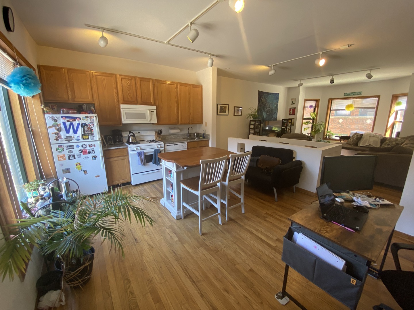 632 West Patterson Avenue, Unit 1N Chicago, IL 60613 - Photo 11 of 17 a view of a dining room with furniture window and wooden floor