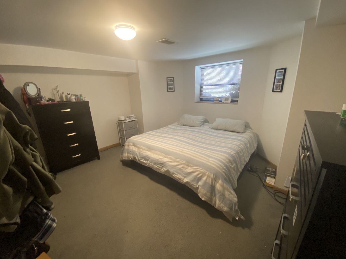 632 West Patterson Avenue, Unit 1N Chicago, IL 60613 - Photo 15 of 17 a bedroom with a bed and a night stand