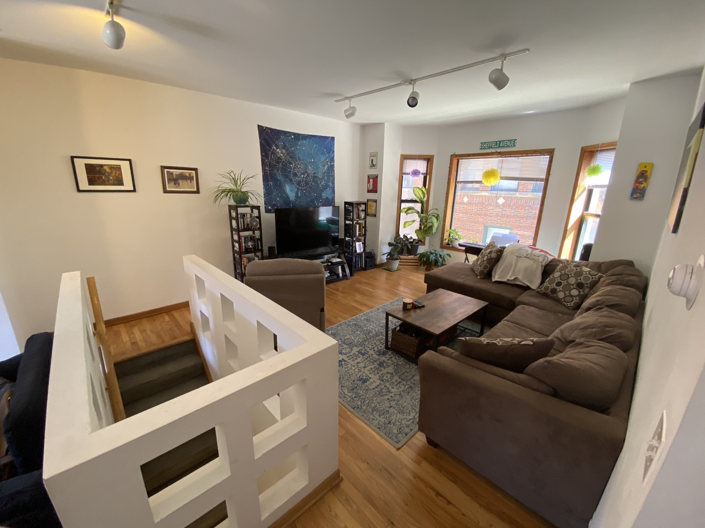 632 West Patterson Avenue, Unit 1N Chicago, IL 60613 - Photo 6 of 17 a living room with furniture and a large window