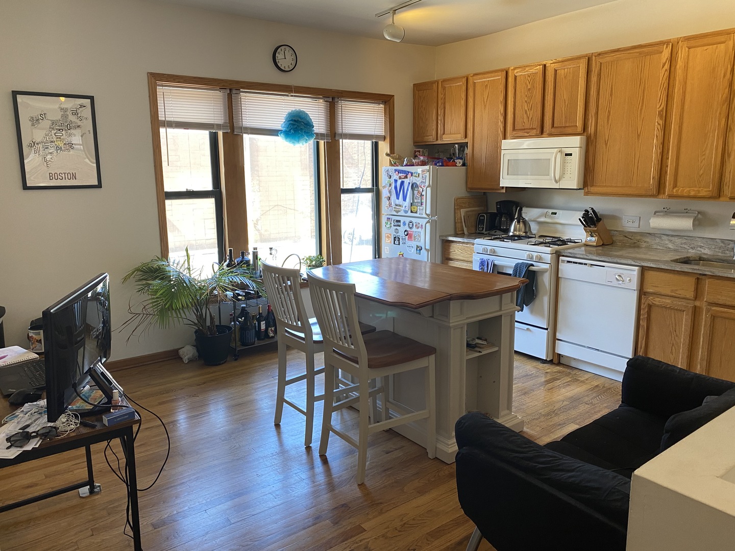 632 West Patterson Avenue, Unit 1N Chicago, IL 60613 - Photo 8 of 17 a view of a dining room with furniture window and wooden floor