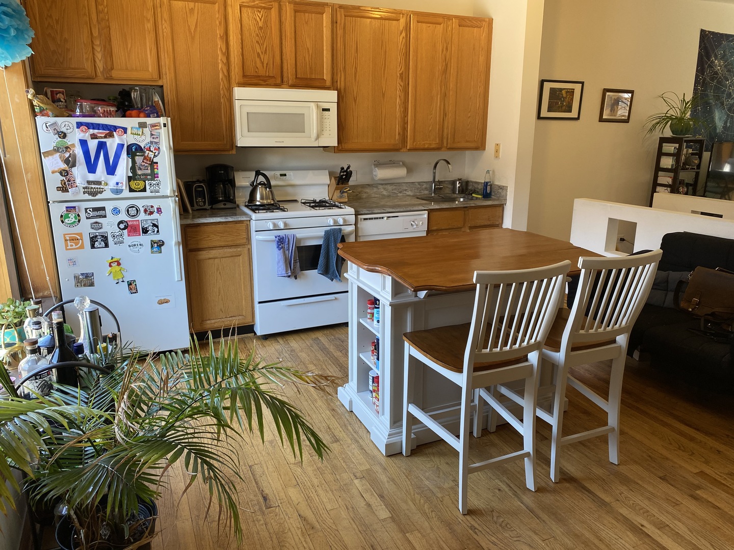 632 West Patterson Avenue, Unit 1N Chicago, IL 60613 - Photo 10 of 17 a dining room with furniture and a kitchen view