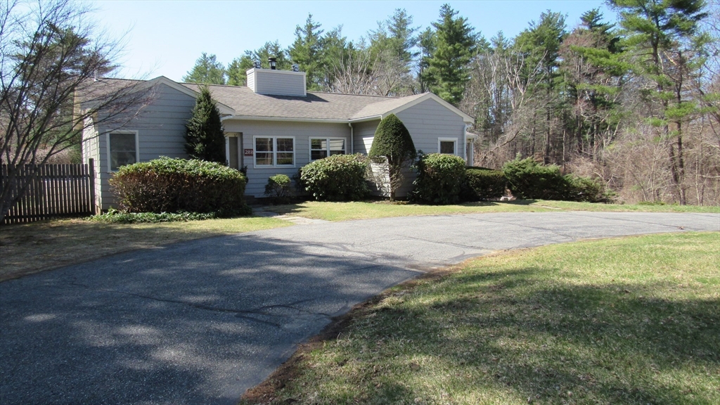 288 Linebrook Road Ipswich, MA 01938 - Photo 14 of 26 a front view of a house with a yard and garage