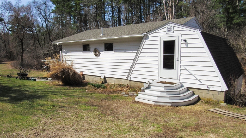 288 Linebrook Road Ipswich, MA 01938 - Photo 15 of 26 a front view of a house with a yard