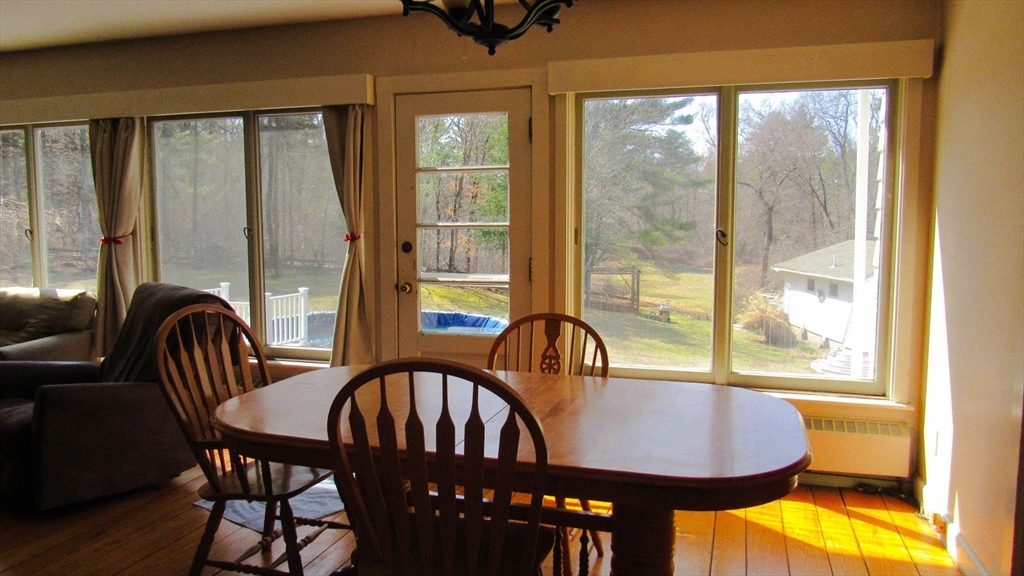 288 Linebrook Road Ipswich, MA 01938 - Photo 2 of 26 a view of a dining room with furniture window and outside view
