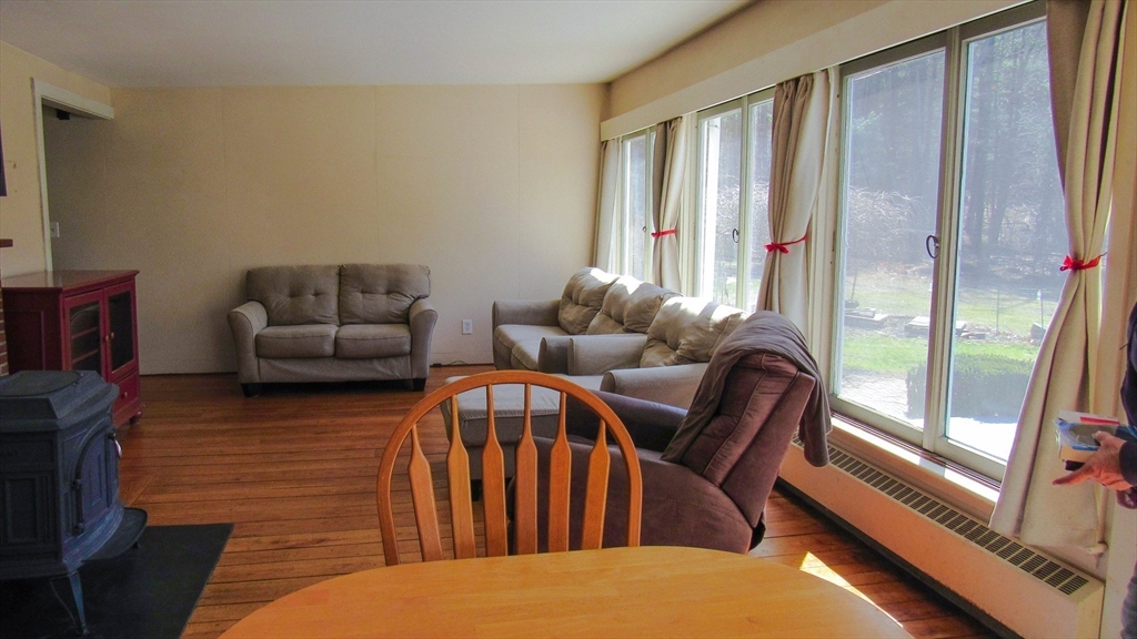 288 Linebrook Road Ipswich, MA 01938 - Photo 5 of 26 a bedroom with furniture and a large window