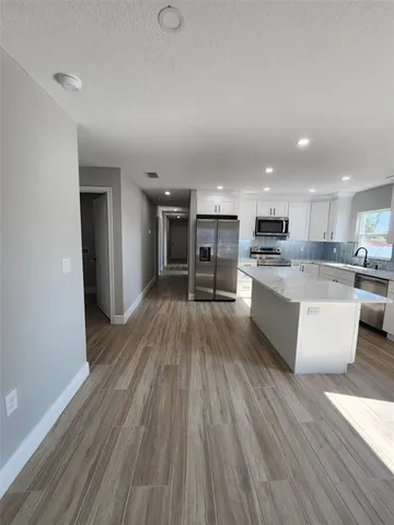a large kitchen with cabinets
