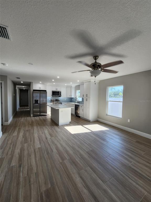1013 13th Street East Bradenton, FL 34208 - Photo 12 of 14 a view of a kitchen with a sink and a stove top oven