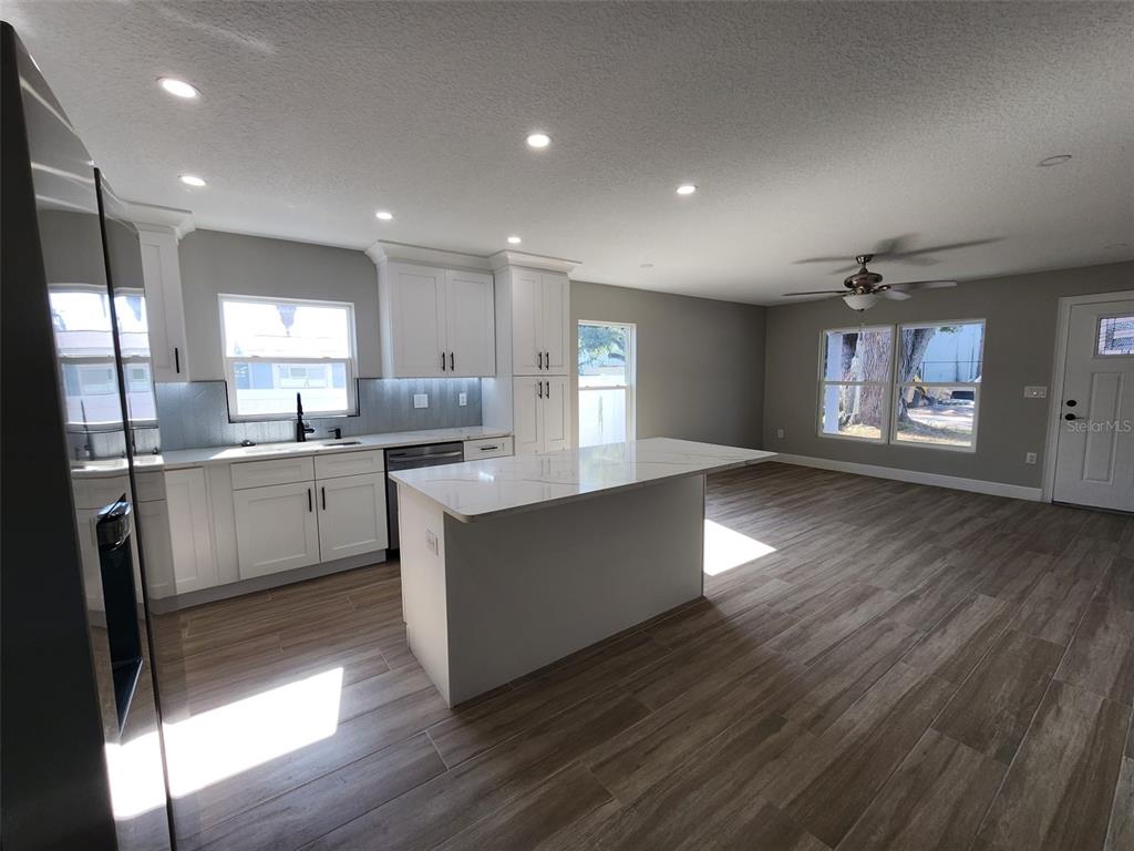 1013 13th Street East Bradenton, FL 34208 - Photo 13 of 14 a kitchen with counter top space cabinets and appliances