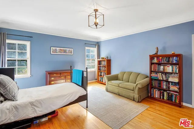 a living room with furniture workspace and a window