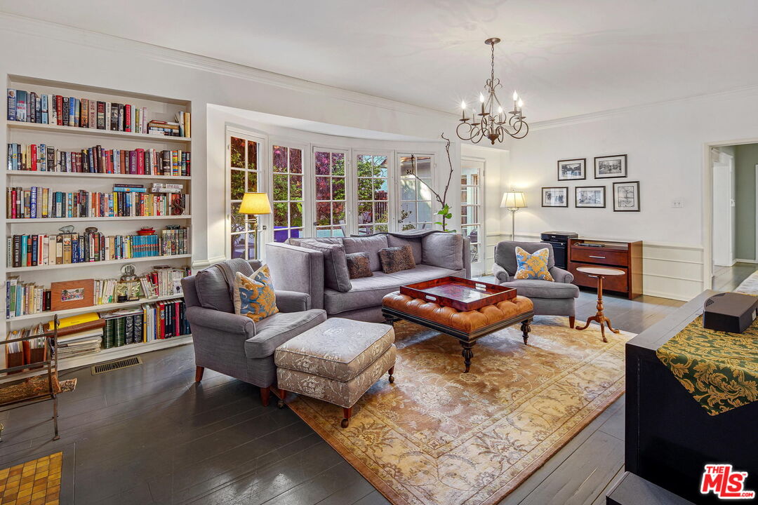 10614 Le Conte Avenue Los Angeles, CA 90024 - Photo 9 of 33 a living room with furniture a bookshelf and a bookshelf