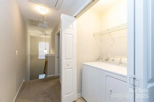 an empty room with a window and a ceiling fan