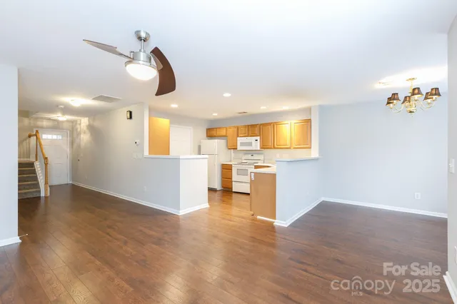 a view of a kitchen with a microwave and a floor to ceiling window