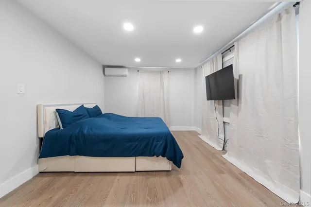 a living room with a flat screen tv and a couch