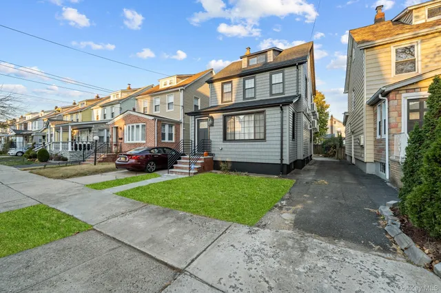 a car parked in front of a brick house