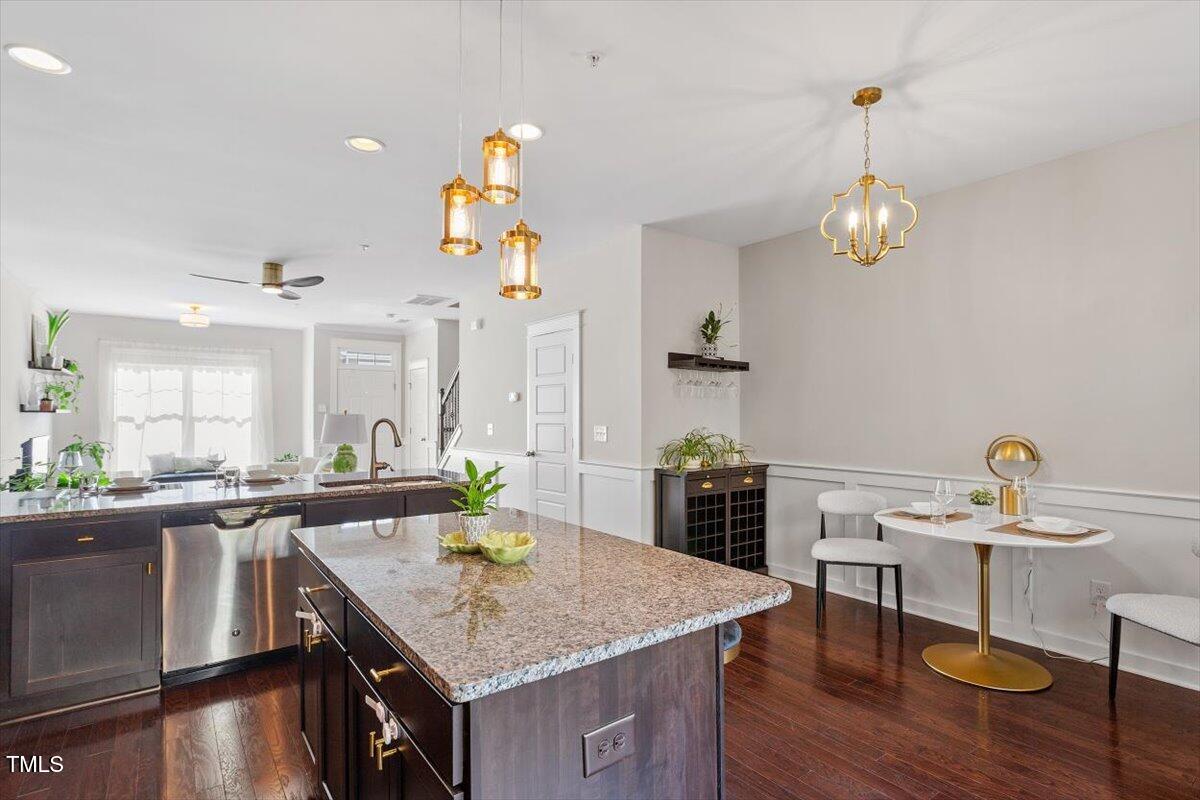 7822 Allscott Way Raleigh, NC 27612 - Photo 16 of 33 a kitchen with a table and chairs in it