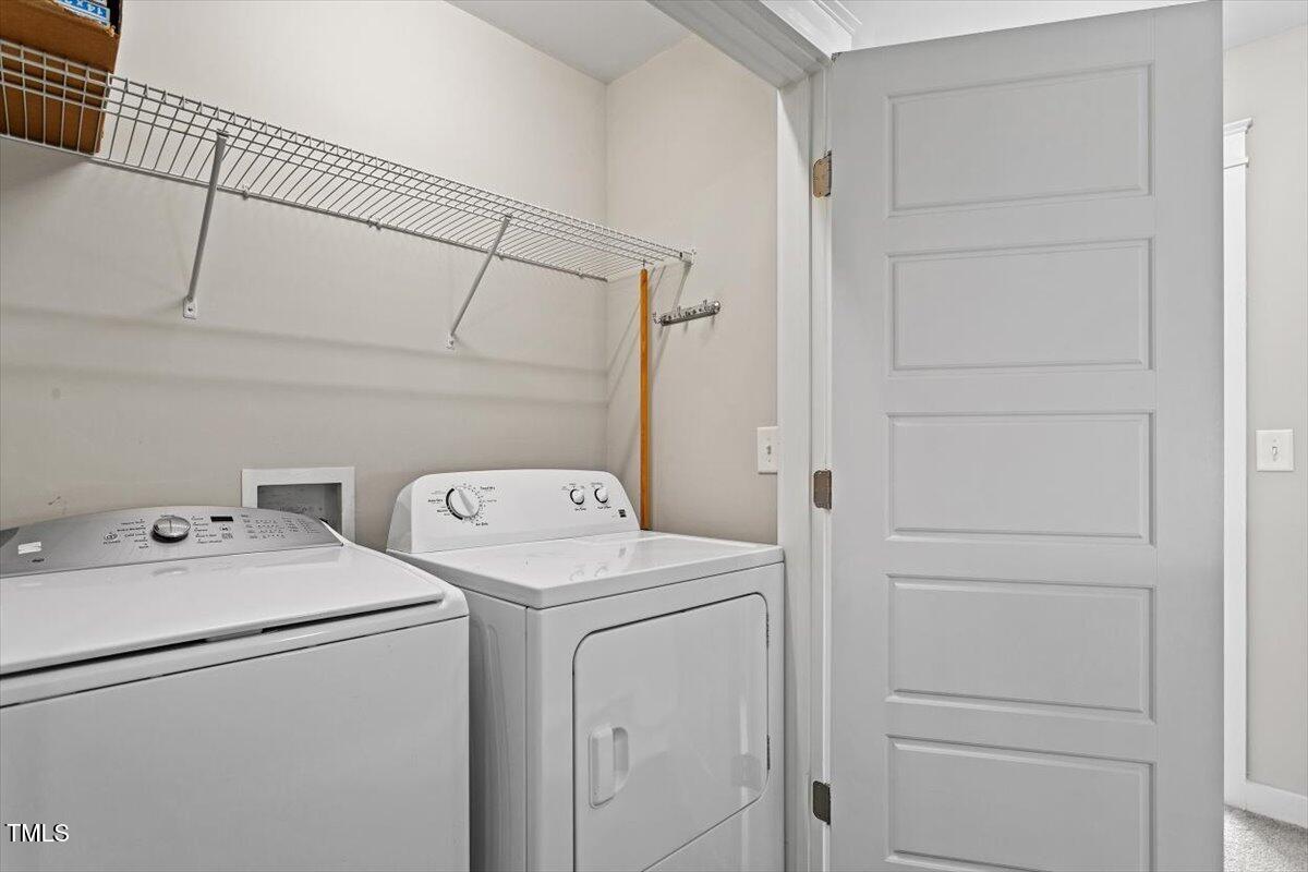 7822 Allscott Way Raleigh, NC 27612 - Photo 26 of 33 a utility room with dryer and washer