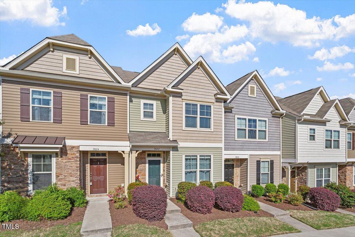 7822 Allscott Way Raleigh, NC 27612 - Photo 2 of 33 a front view of multiple houses
