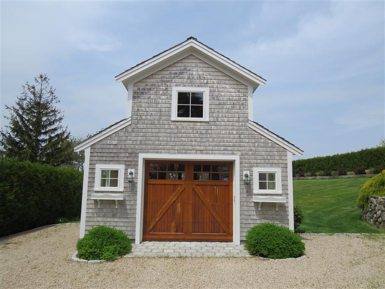 247 Seapine Road North Chatham, MA 02650 - Photo 10 of 27 a front view of a house with a yard and garage