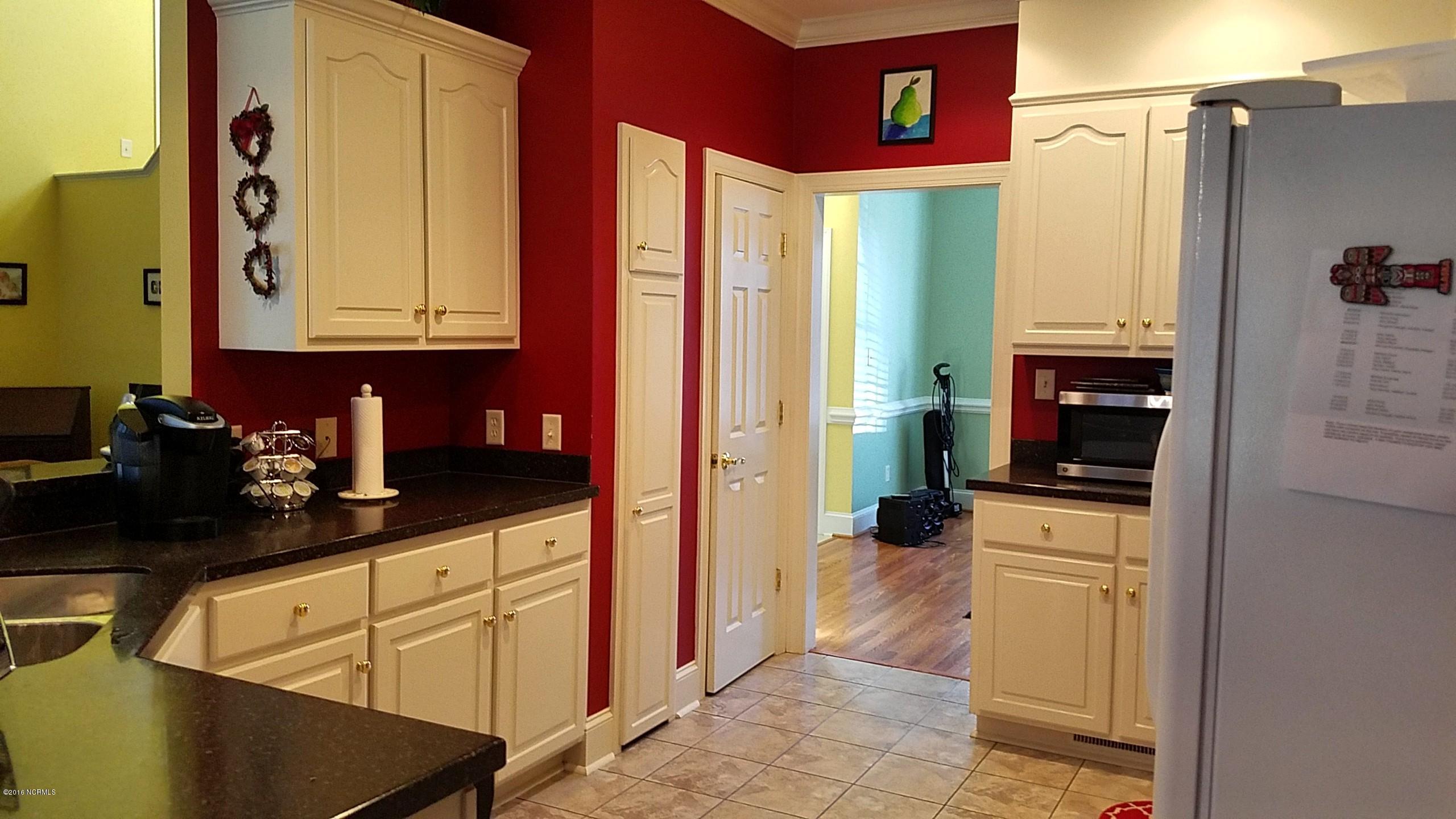 2629 Westridge Road Kinston, NC 28504 - Photo 4 of 23 kitchen with pantry and eat in bar