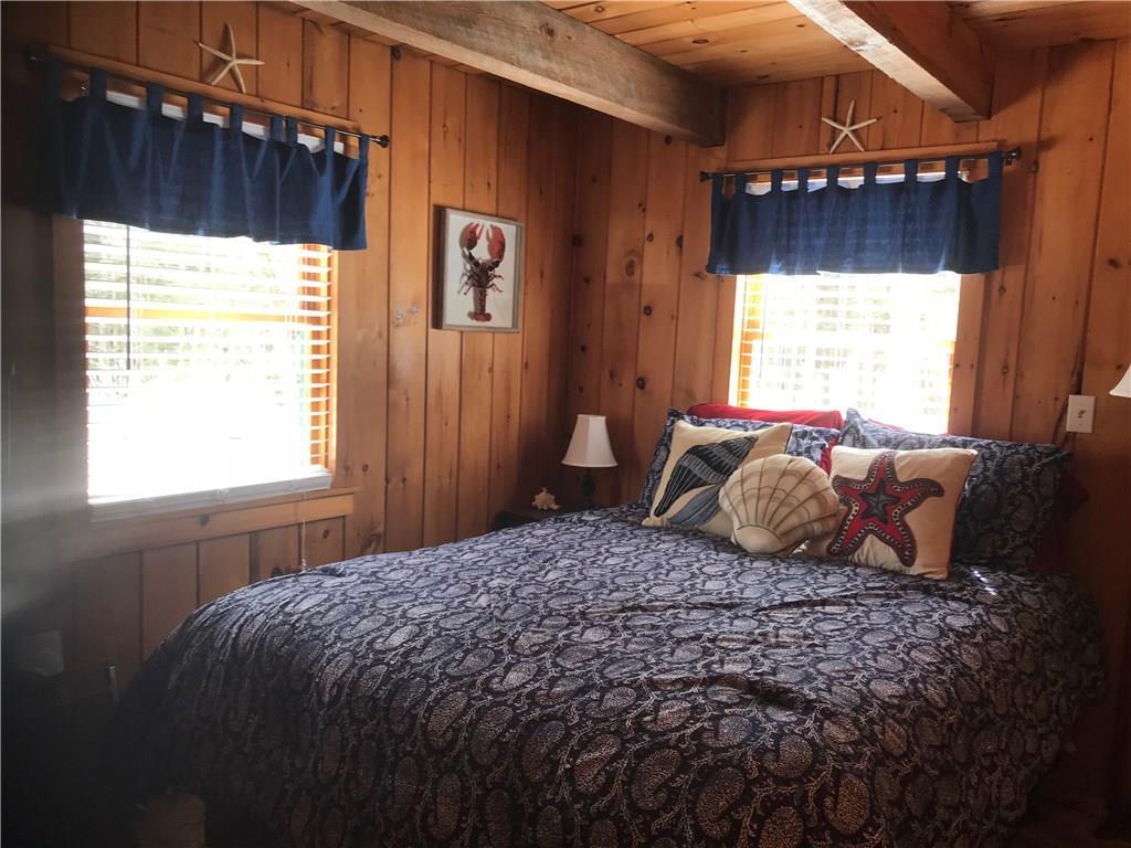 572 Springy Pond Road Otis, ME 04605 - Photo 10 of 18 Main camp first floor bedroom.